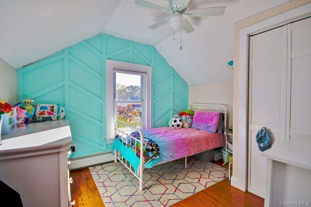 22 High Street Garnerville, NY 10923 - Photo 26 of 49 a bedroom with a bed and a bookshelf