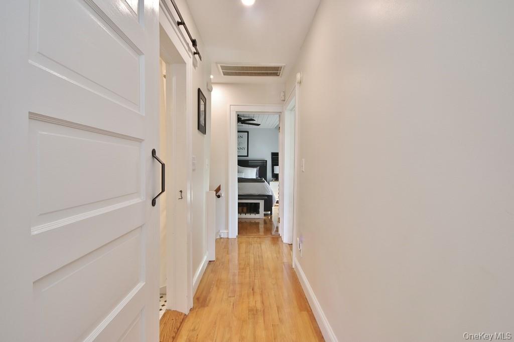 22 High Street Garnerville, NY 10923 - Photo 27 of 49 a view of a hallway with wooden floor and staircase