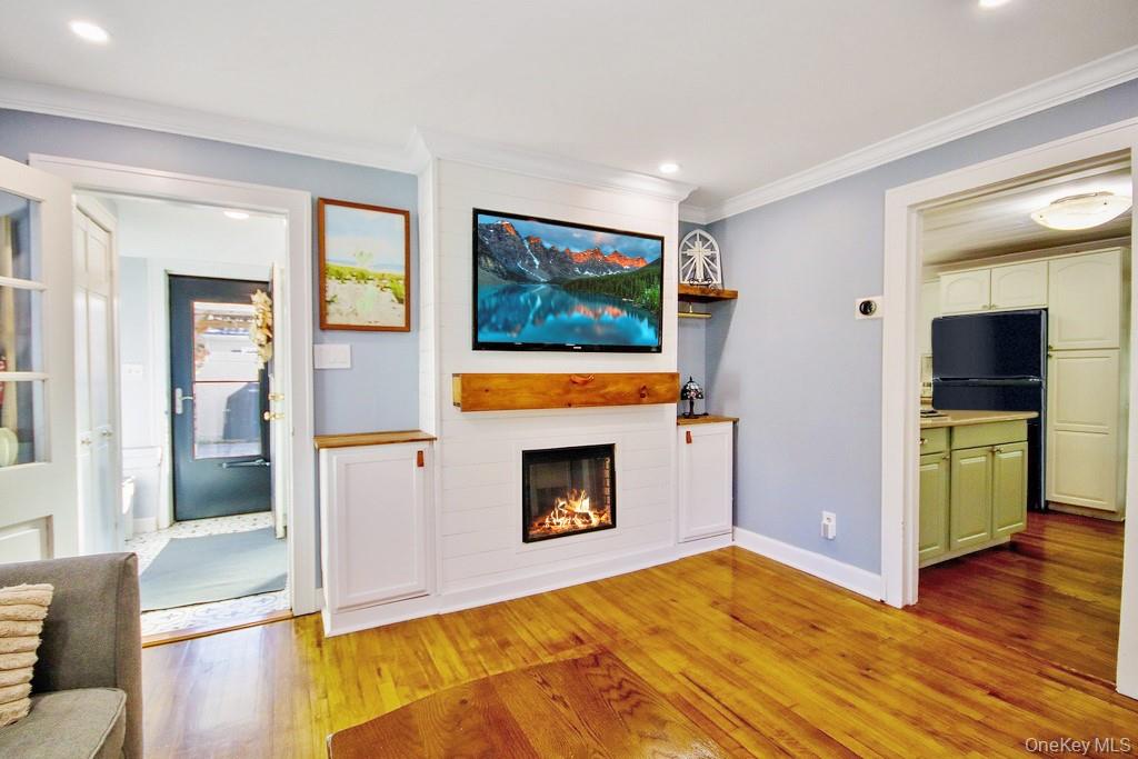 22 High Street Garnerville, NY 10923 - Photo 10 of 49 a living room with furniture and a flat screen tv