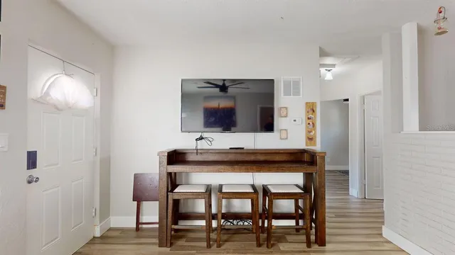 a kitchen with a table and chairs in it