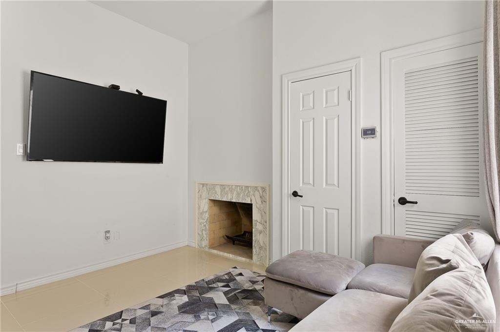 3100 South 2nd Street, Unit 29 McAllen, TX 78503 - Photo 12 of 23 a living room with furniture and a flat screen tv