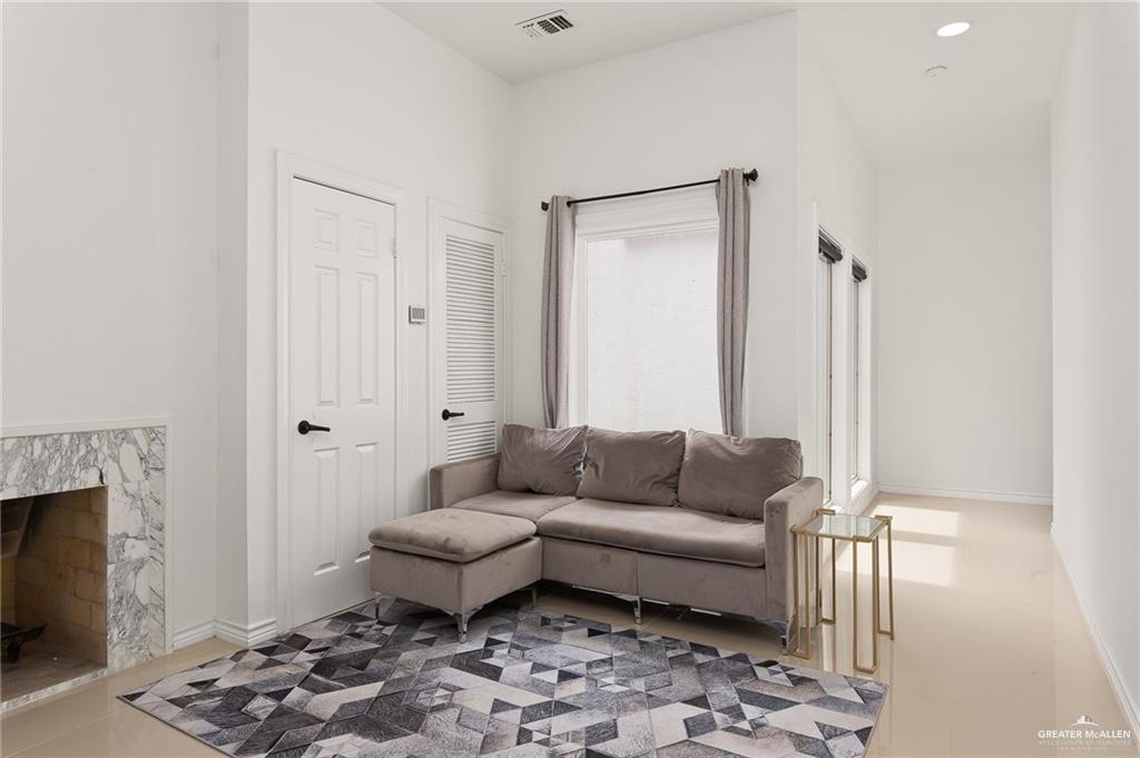 3100 South 2nd Street, Unit 29 McAllen, TX 78503 - Photo 13 of 23 a living room with furniture and a rug