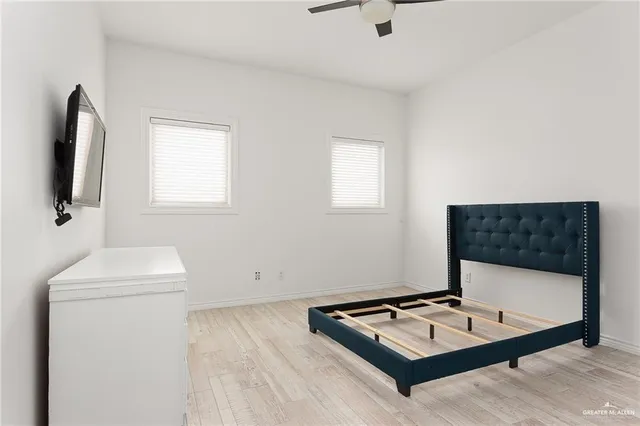 a living room with a couch a rug and a flat screen tv