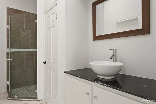a bathroom with a sink and a mirror