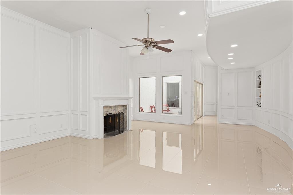 3100 South 2nd Street, Unit 29 McAllen, TX 78503 - Photo 8 of 23 an empty room with windows and fireplace