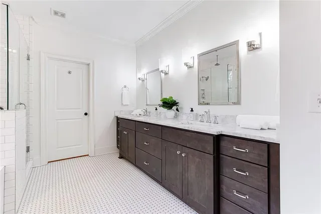 a spacious bathroom with a double vanity sink double and mirror