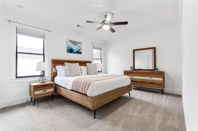 a bedroom with a bed and window