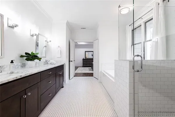 a bathroom with a double vanity sink and a mirror