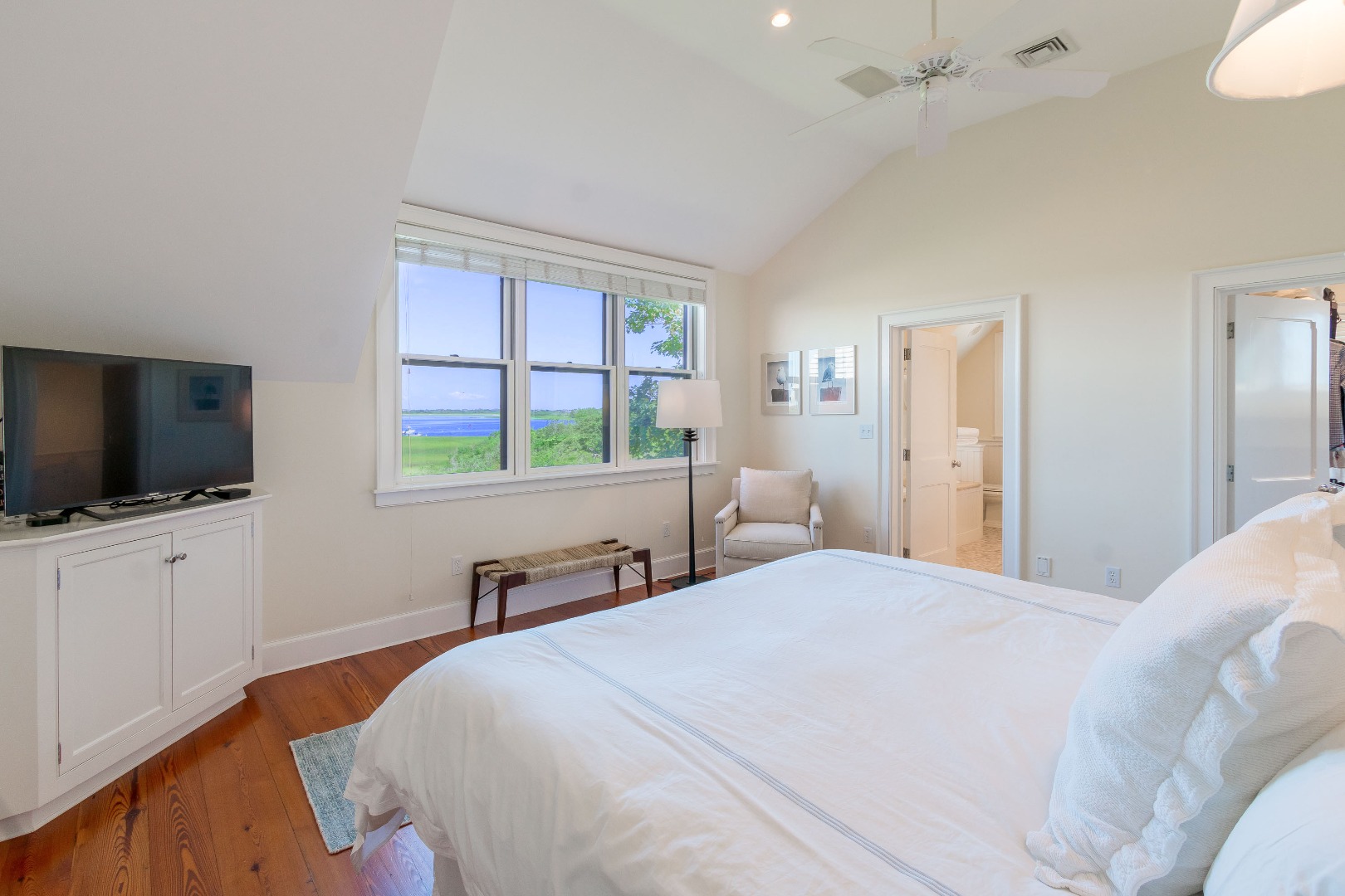 240 Polpis Road Nantucket, MA 02554 - Photo 17 of 45 a bedroom with a bed and a flat screen tv
