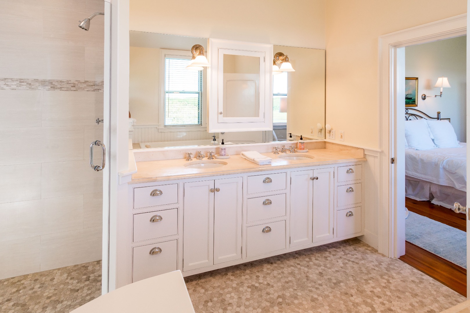 240 Polpis Road Nantucket, MA 02554 - Photo 20 of 45 a spacious bathroom with a double vanity sink a mirror and a bathtub