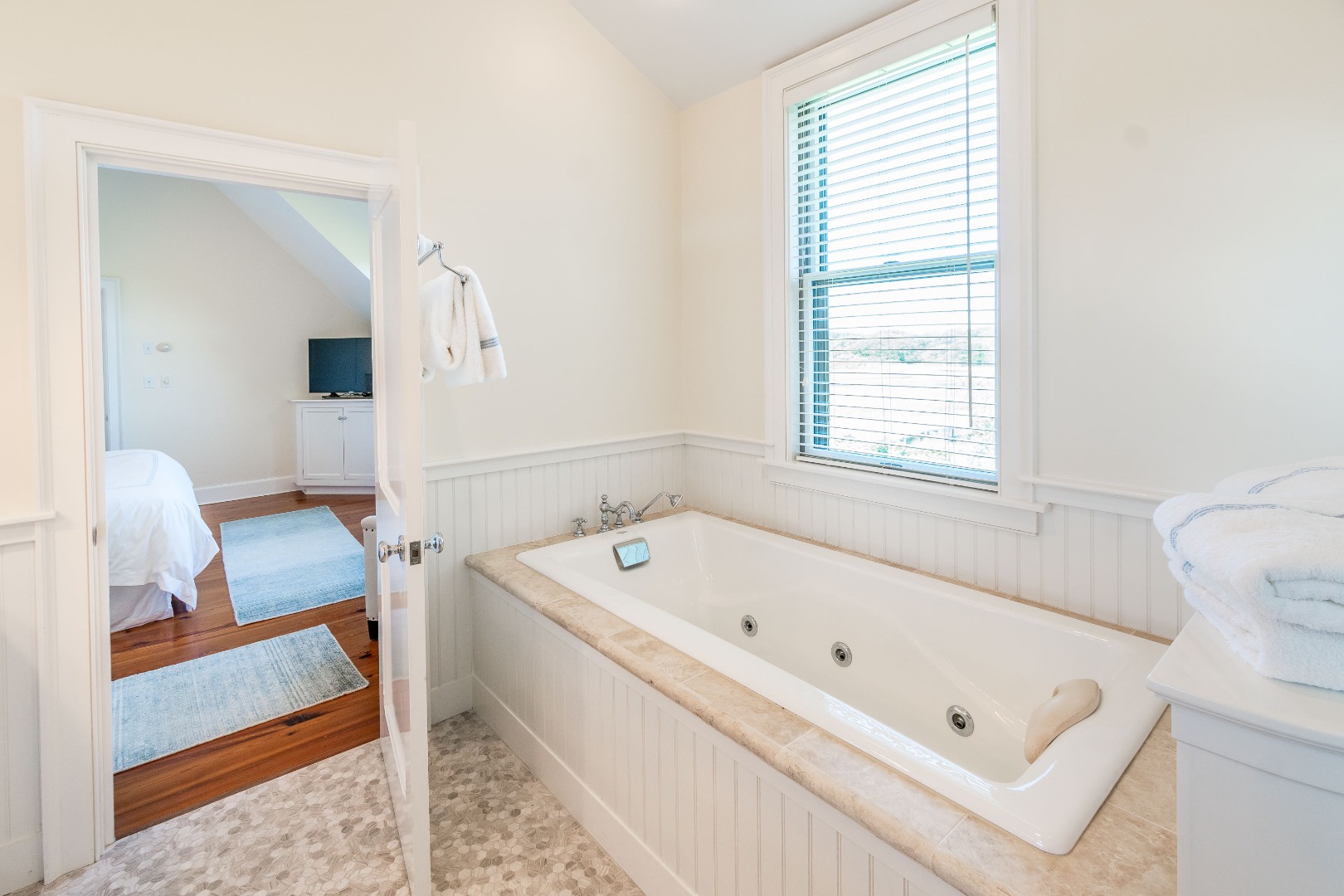 240 Polpis Road Nantucket, MA 02554 - Photo 21 of 45 a bathroom with a tub a sink and a window