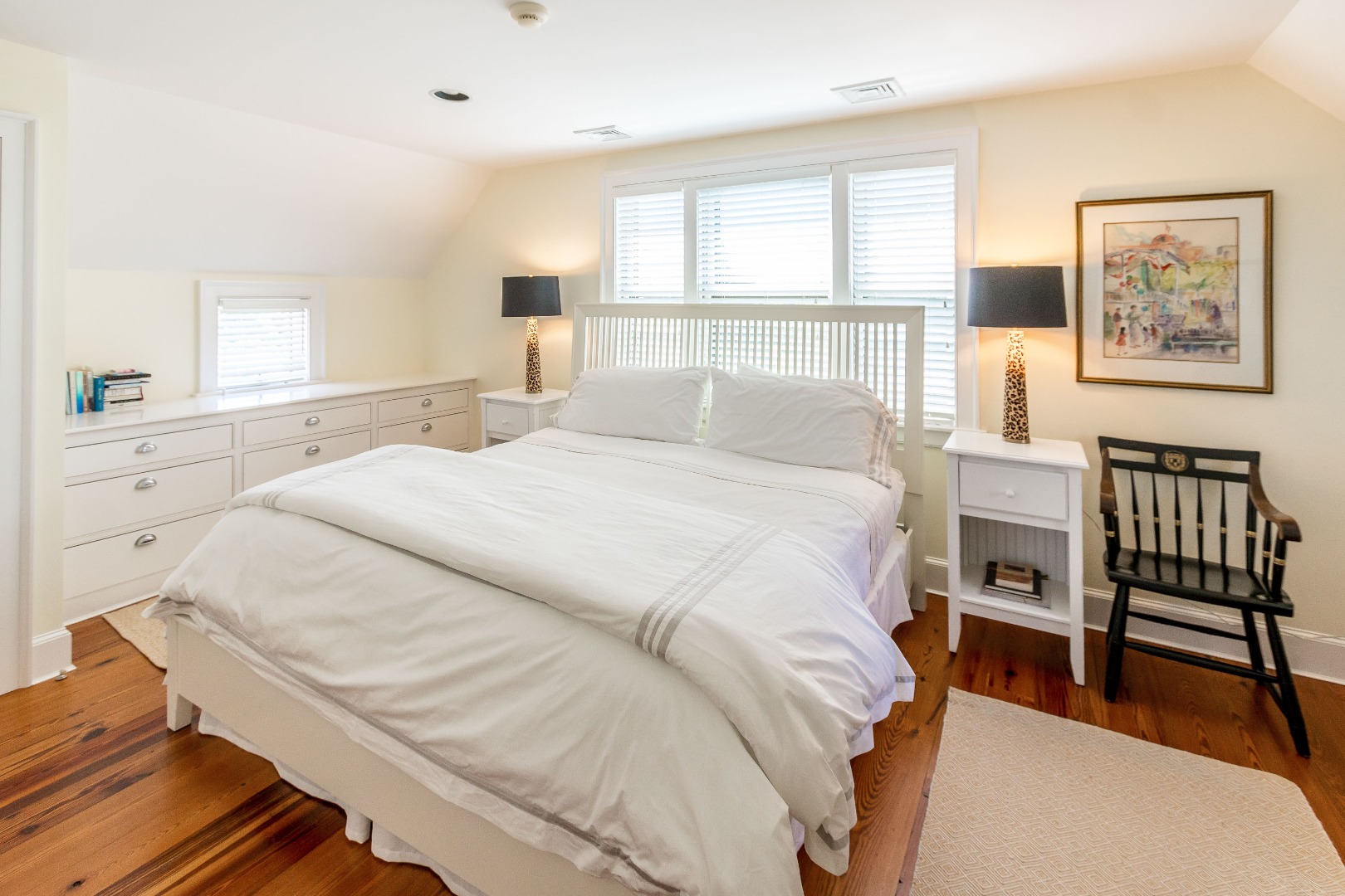 240 Polpis Road Nantucket, MA 02554 - Photo 25 of 45 a bedroom with a bed and wooden floor