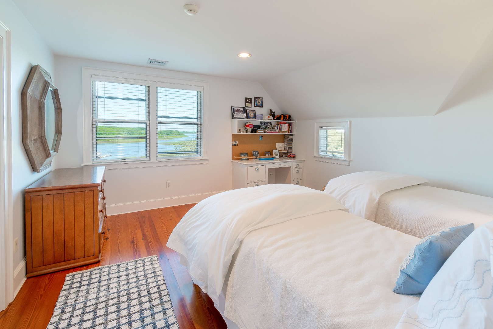 240 Polpis Road Nantucket, MA 02554 - Photo 27 of 45 a bedroom with a bed and a dresser next to a window