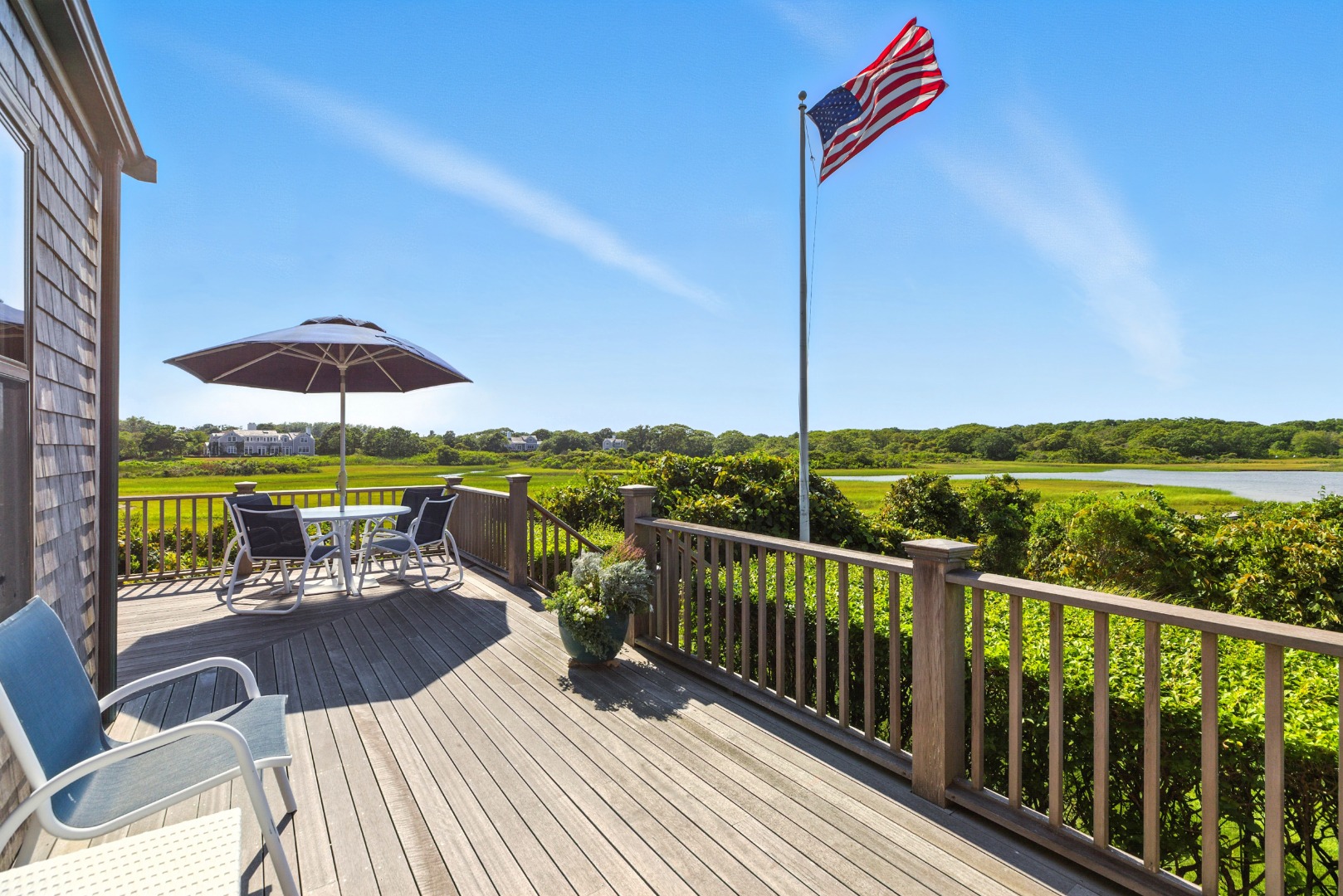 240 Polpis Road Nantucket, MA 02554 - Photo 3 of 45 a view of a balcony with wooden floor and outdoor seating