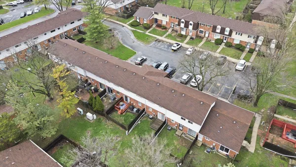 a view of a yard with a tree