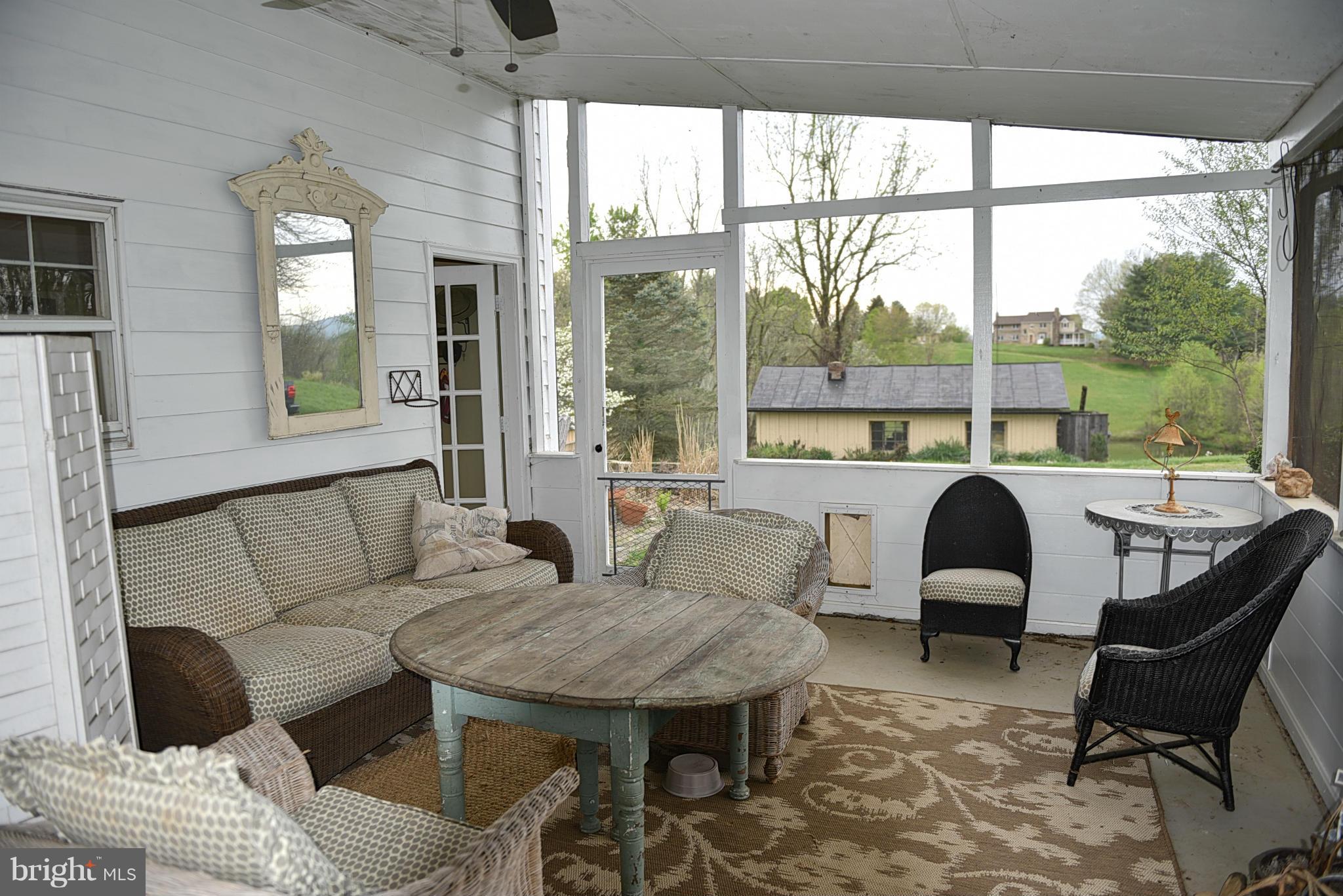 38802 Hughesville Road Hamilton, VA 20158 - Photo 22 of 30 Screened in porch with pond and mountain views