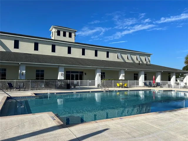 a front view of a house with swimming pool