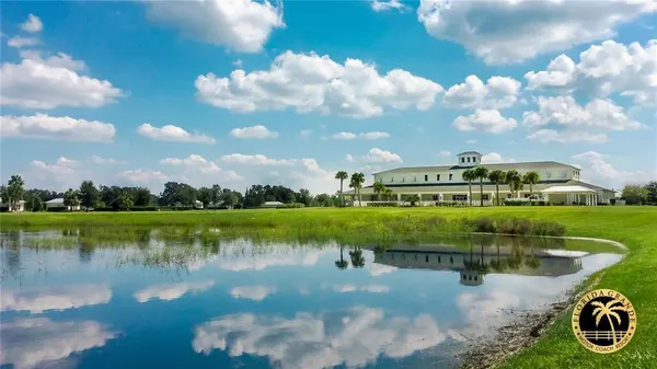 a view of a lake with houses in the back