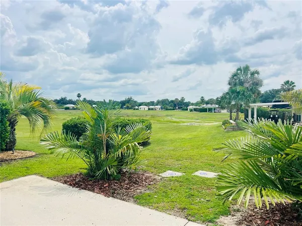 a view of a lake with a big yard