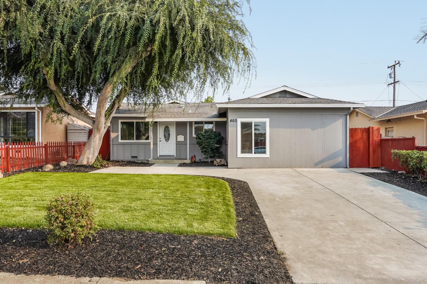 a view of house with outdoor space and swimming pool