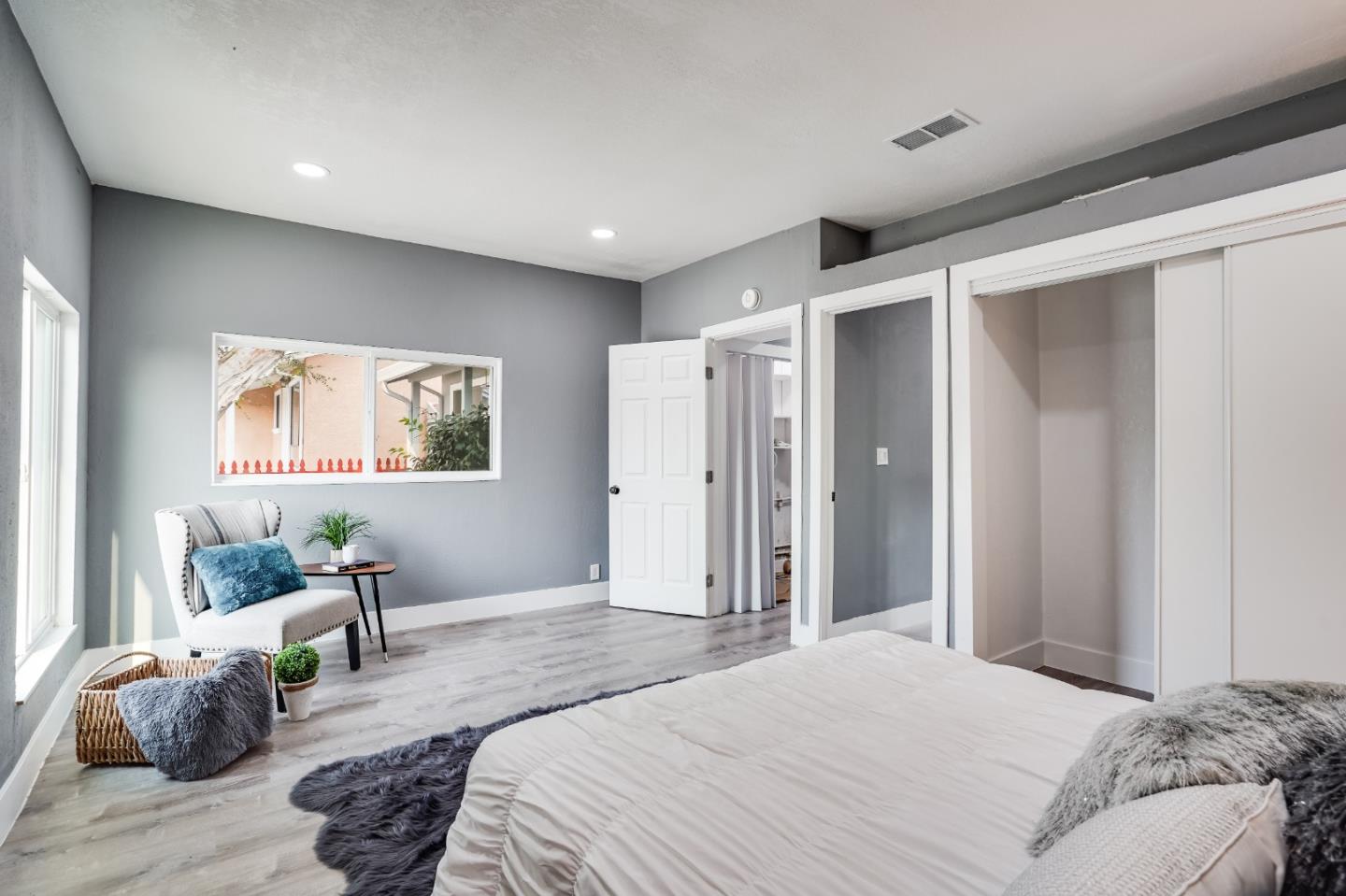 460 Dixon Road Milpitas, CA 95035 - Photo 16 of 36 a bedroom with a bed and a window