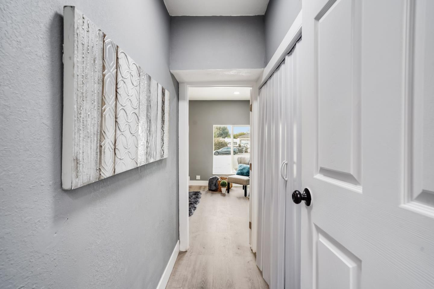 460 Dixon Road Milpitas, CA 95035 - Photo 18 of 36 a view of a hallway with wooden floor and closet