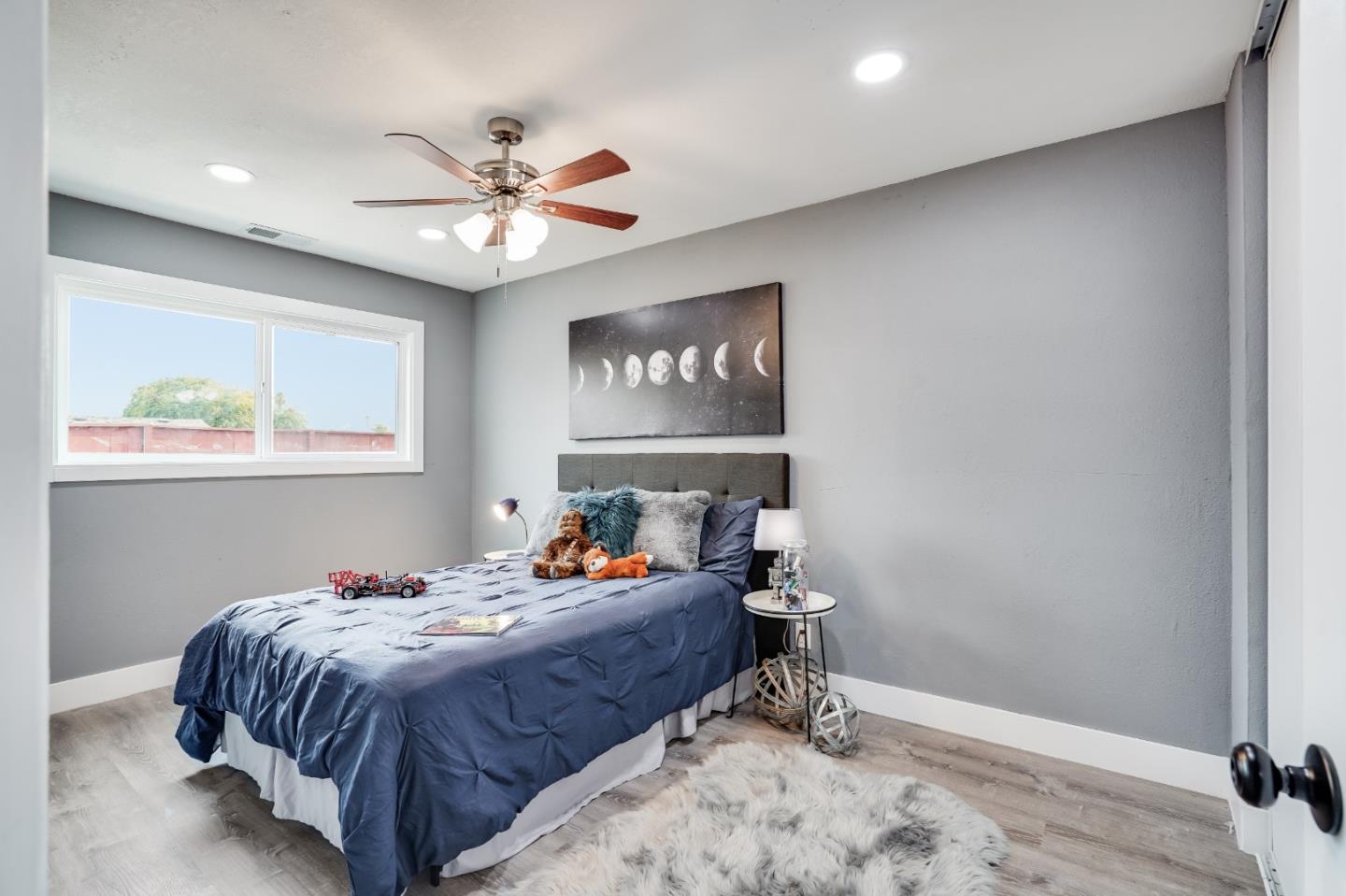 460 Dixon Road Milpitas, CA 95035 - Photo 20 of 36 a bedroom with a bed and a chandelier