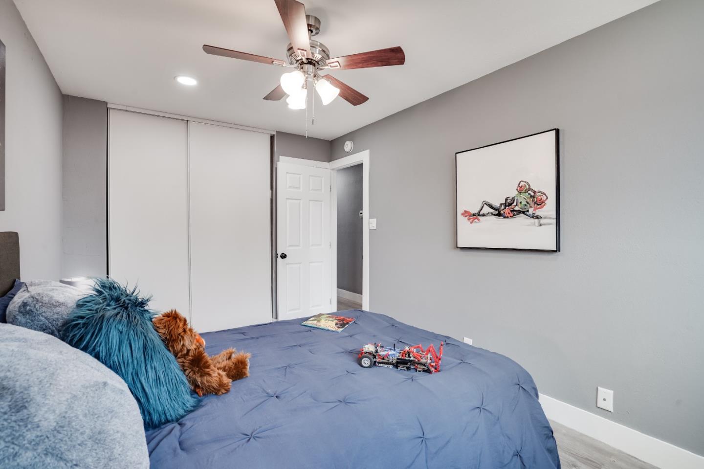 460 Dixon Road Milpitas, CA 95035 - Photo 21 of 36 a bedroom with a bed and a chandelier