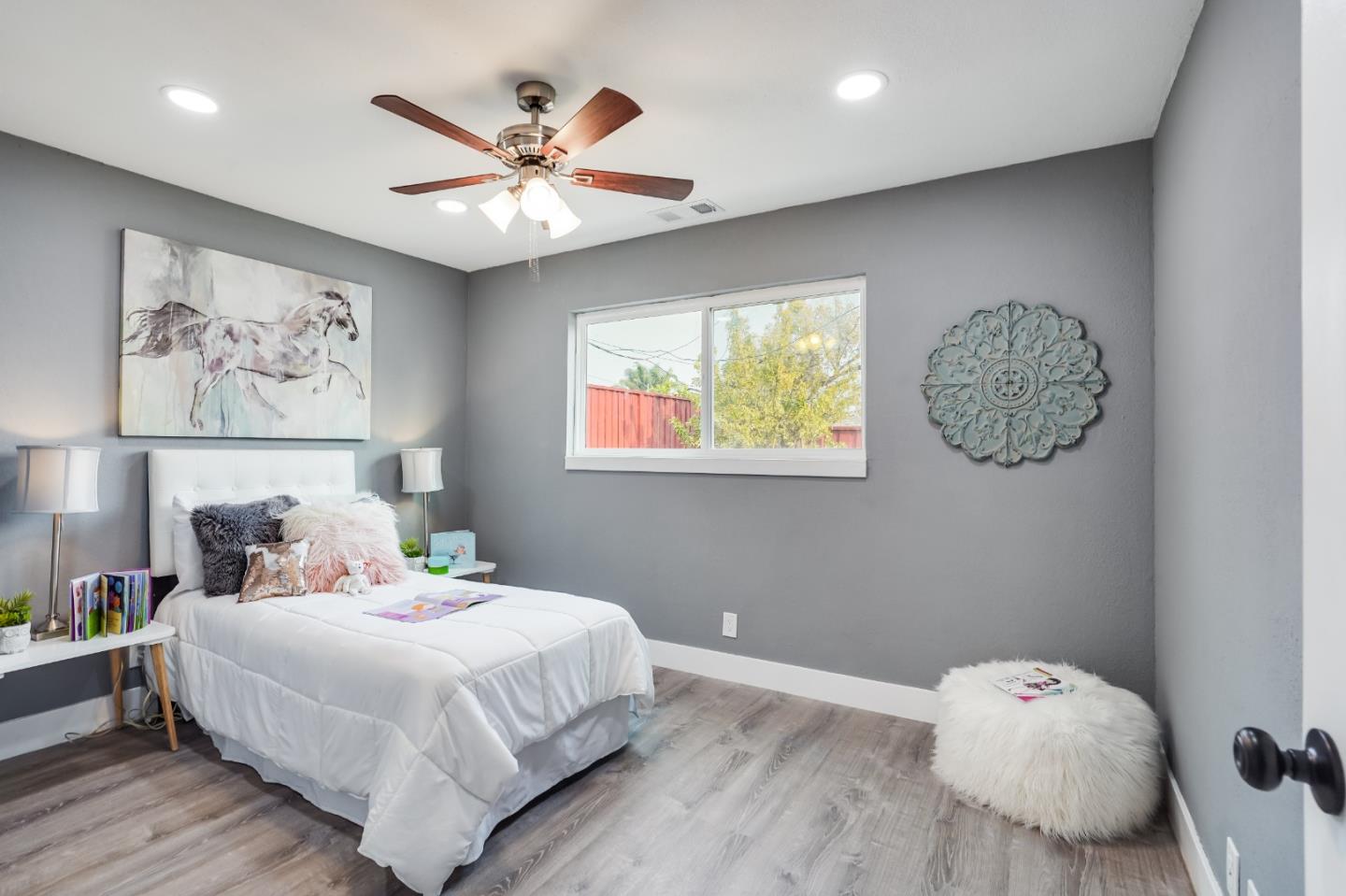 460 Dixon Road Milpitas, CA 95035 - Photo 22 of 36 a bedroom with a bed and a chandelier