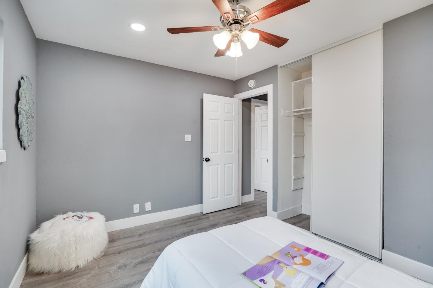 460 Dixon Road Milpitas, CA 95035 - Photo 23 of 36 a bedroom with a bed and a chandelier