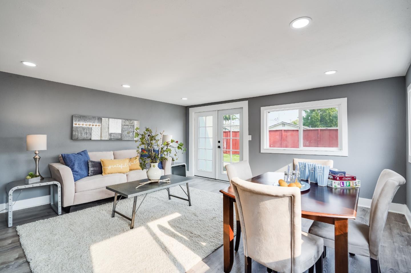 460 Dixon Road Milpitas, CA 95035 - Photo 26 of 36 a living room with furniture a rug and a table