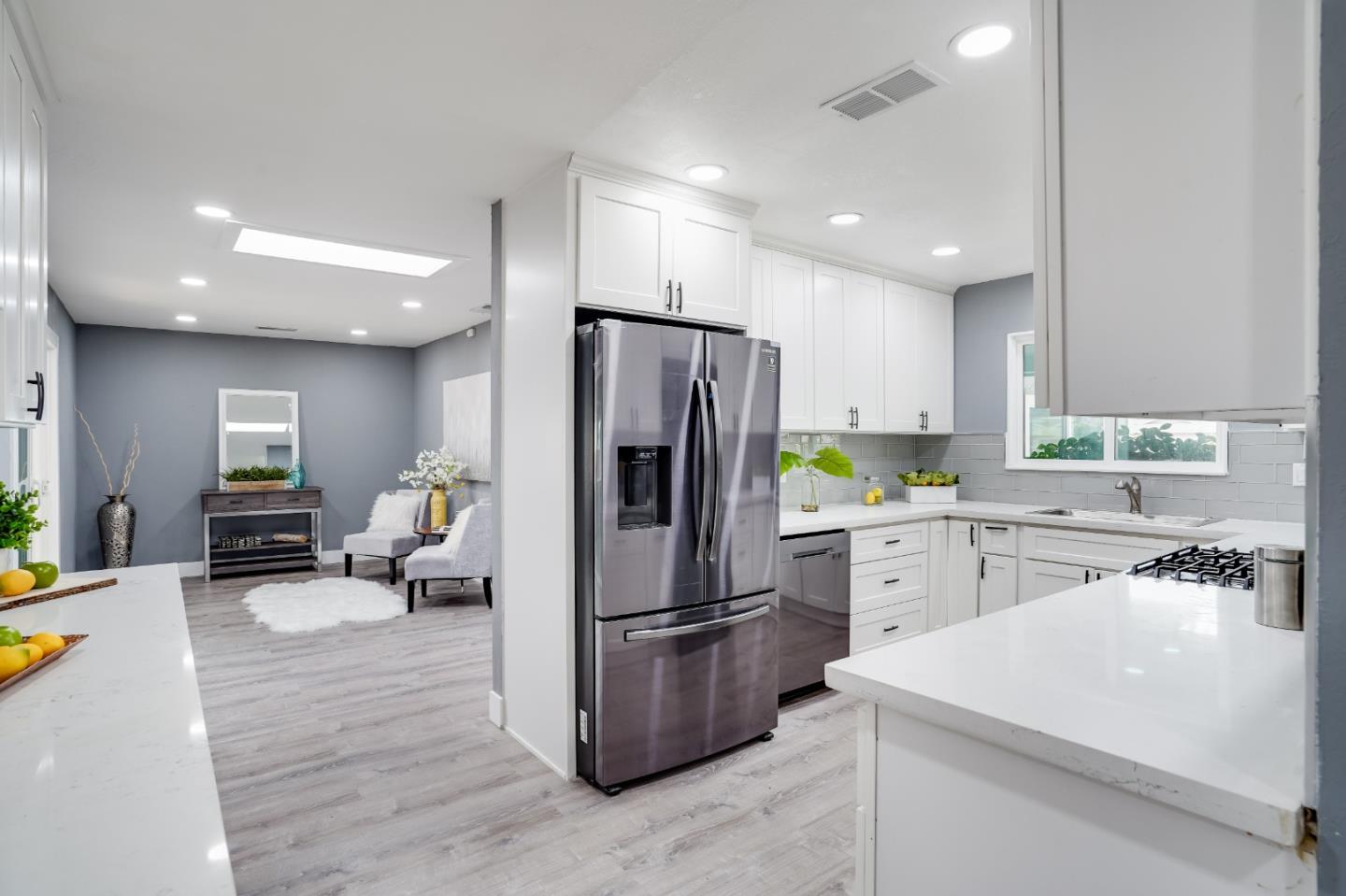 460 Dixon Road Milpitas, CA 95035 - Photo 7 of 36 a kitchen with refrigerator and furniture