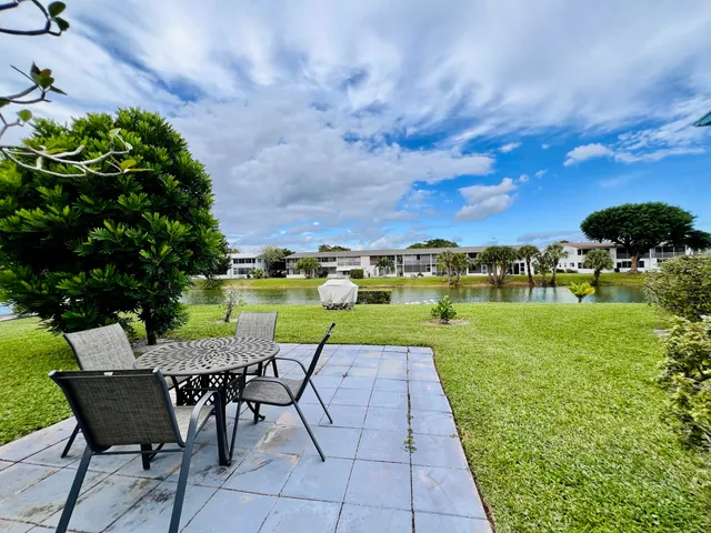 a view of a chairs and table on the garden