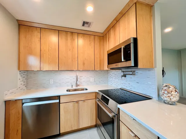 a kitchen with a sink and a microwave
