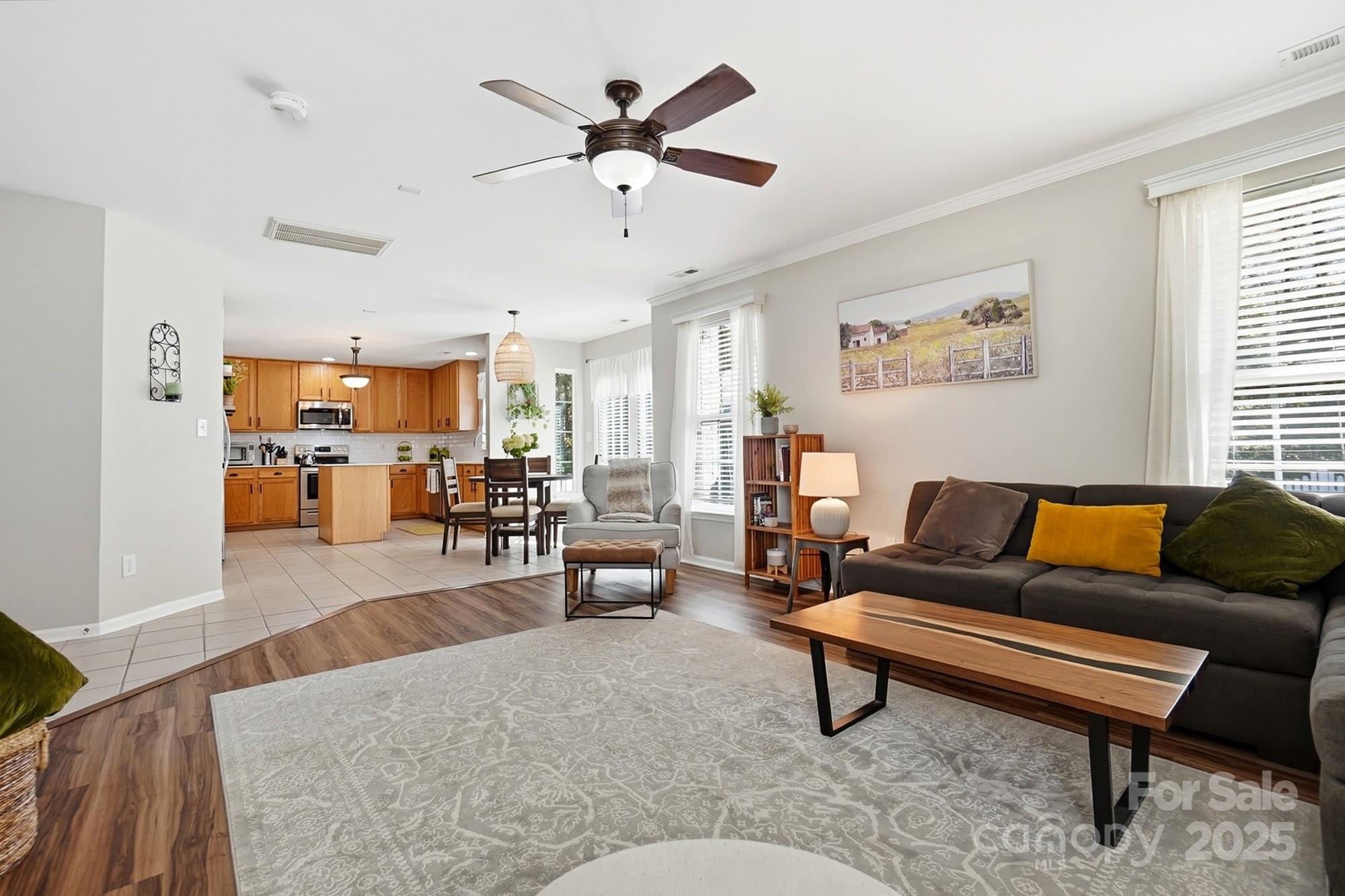 7200 Cascading Pines Drive Tega Cay, SC 29708 - Photo 11 of 39 a living room with furniture and kitchen view