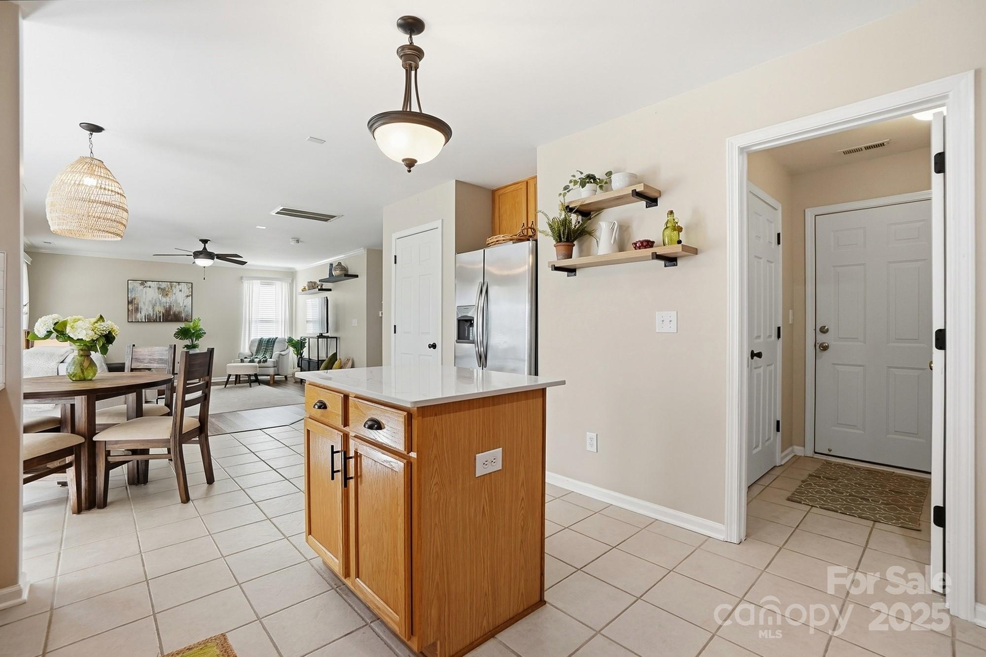 7200 Cascading Pines Drive Tega Cay, SC 29708 - Photo 16 of 39 a kitchen with stainless steel appliances granite countertop a refrigerator and a sink