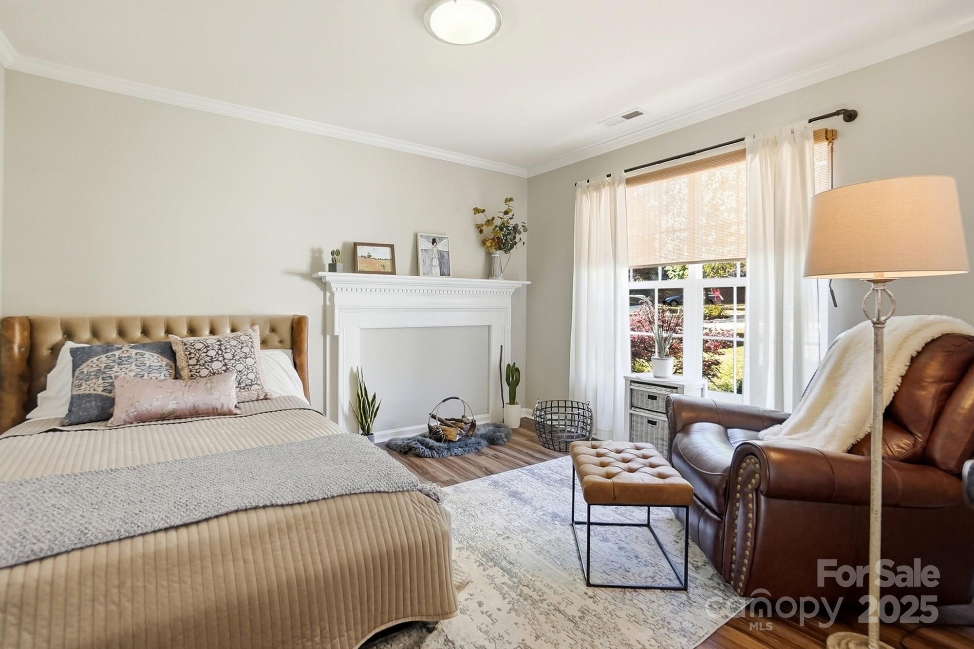 7200 Cascading Pines Drive Tega Cay, SC 29708 - Photo 19 of 39 a bedroom with furniture a bed and a window