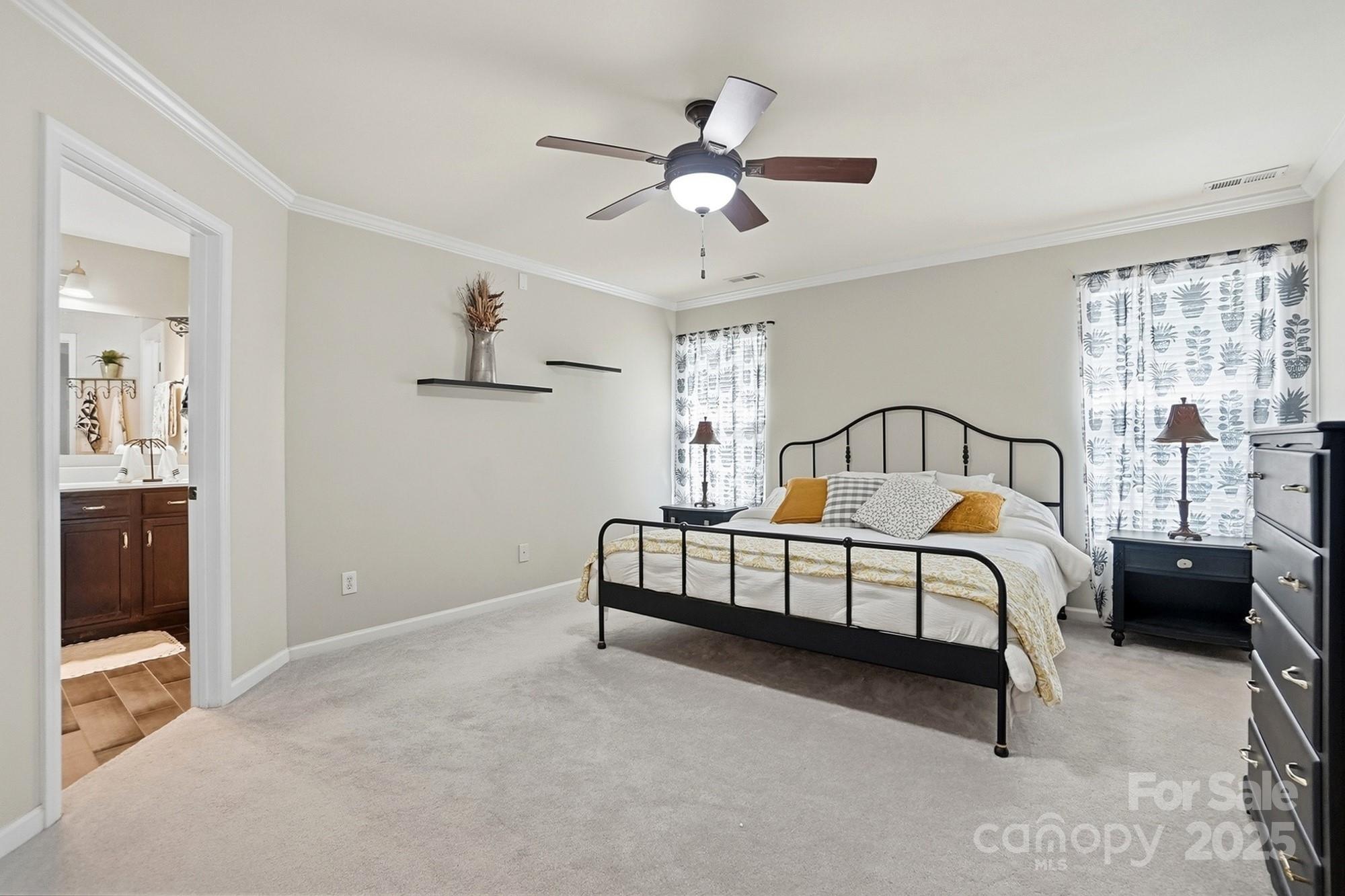 7200 Cascading Pines Drive Tega Cay, SC 29708 - Photo 22 of 39 a bedroom with a bed and window