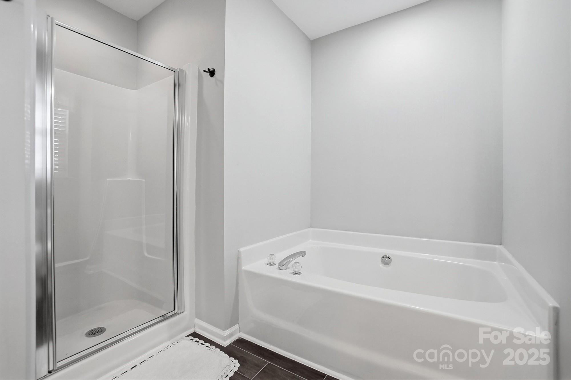 7200 Cascading Pines Drive Tega Cay, SC 29708 - Photo 25 of 39 a white bath tub and shower