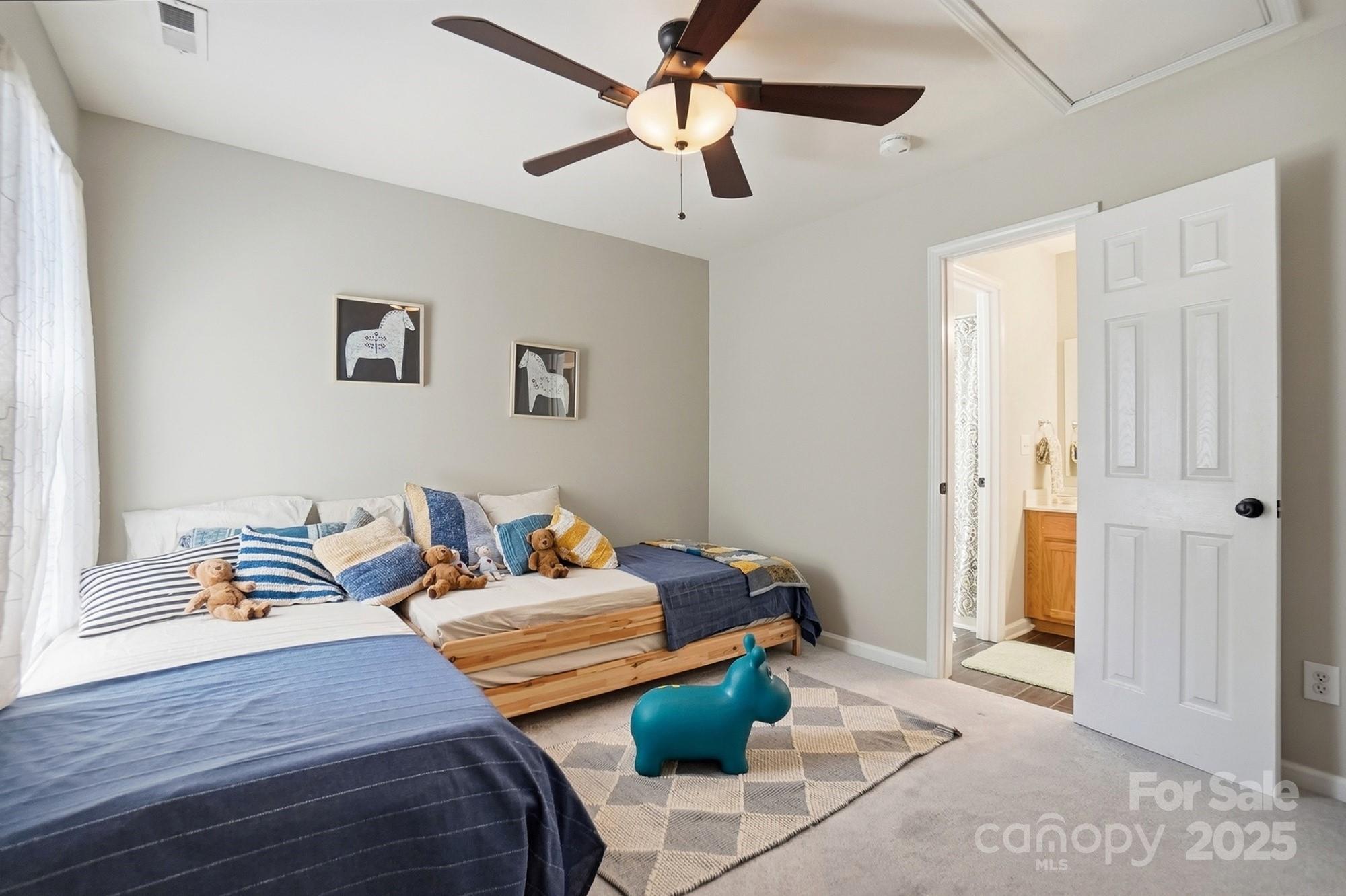 7200 Cascading Pines Drive Tega Cay, SC 29708 - Photo 31 of 39 a bedroom with furniture and a window