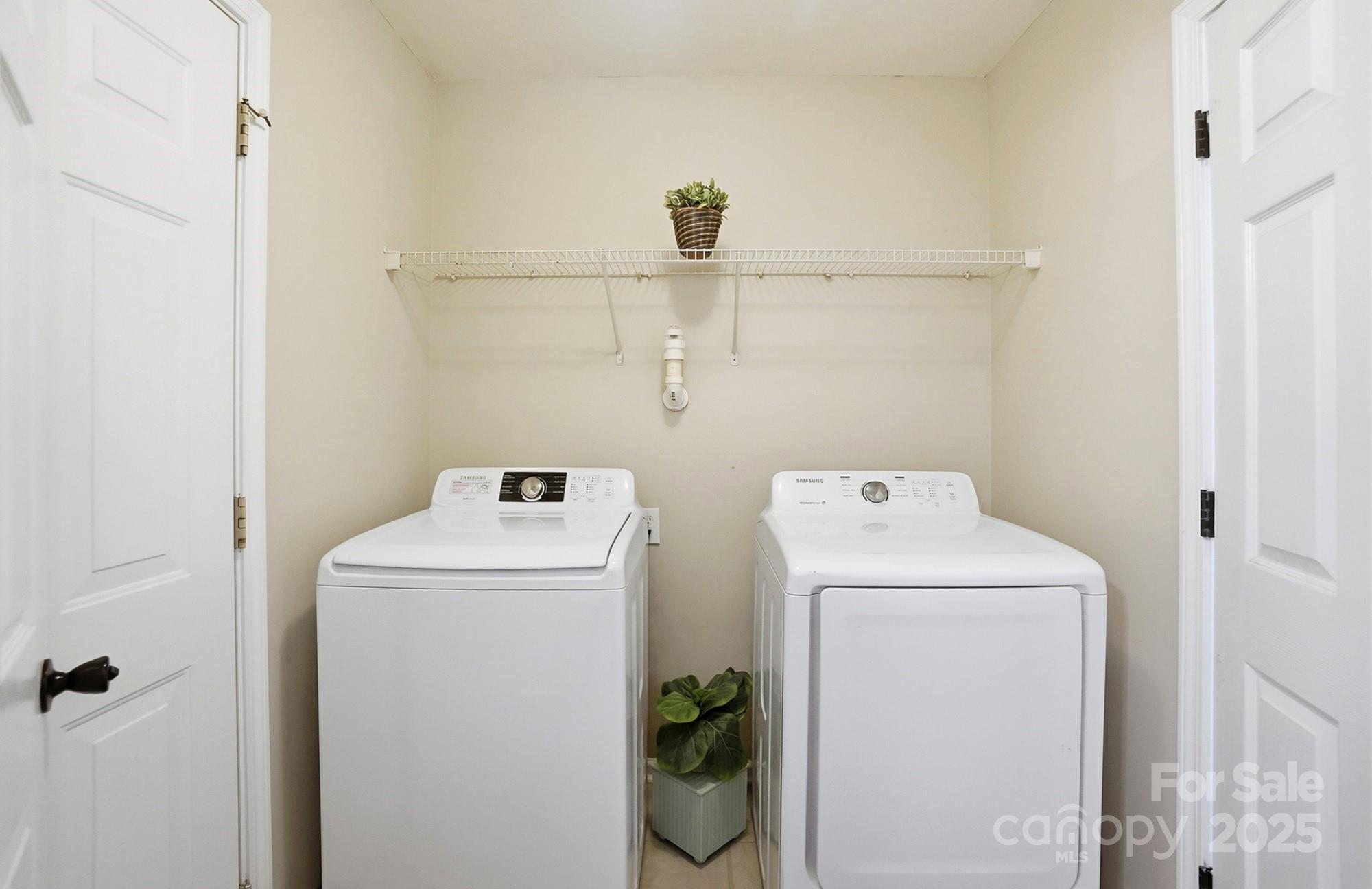 7200 Cascading Pines Drive Tega Cay, SC 29708 - Photo 33 of 39 a utility room with dryer and washer