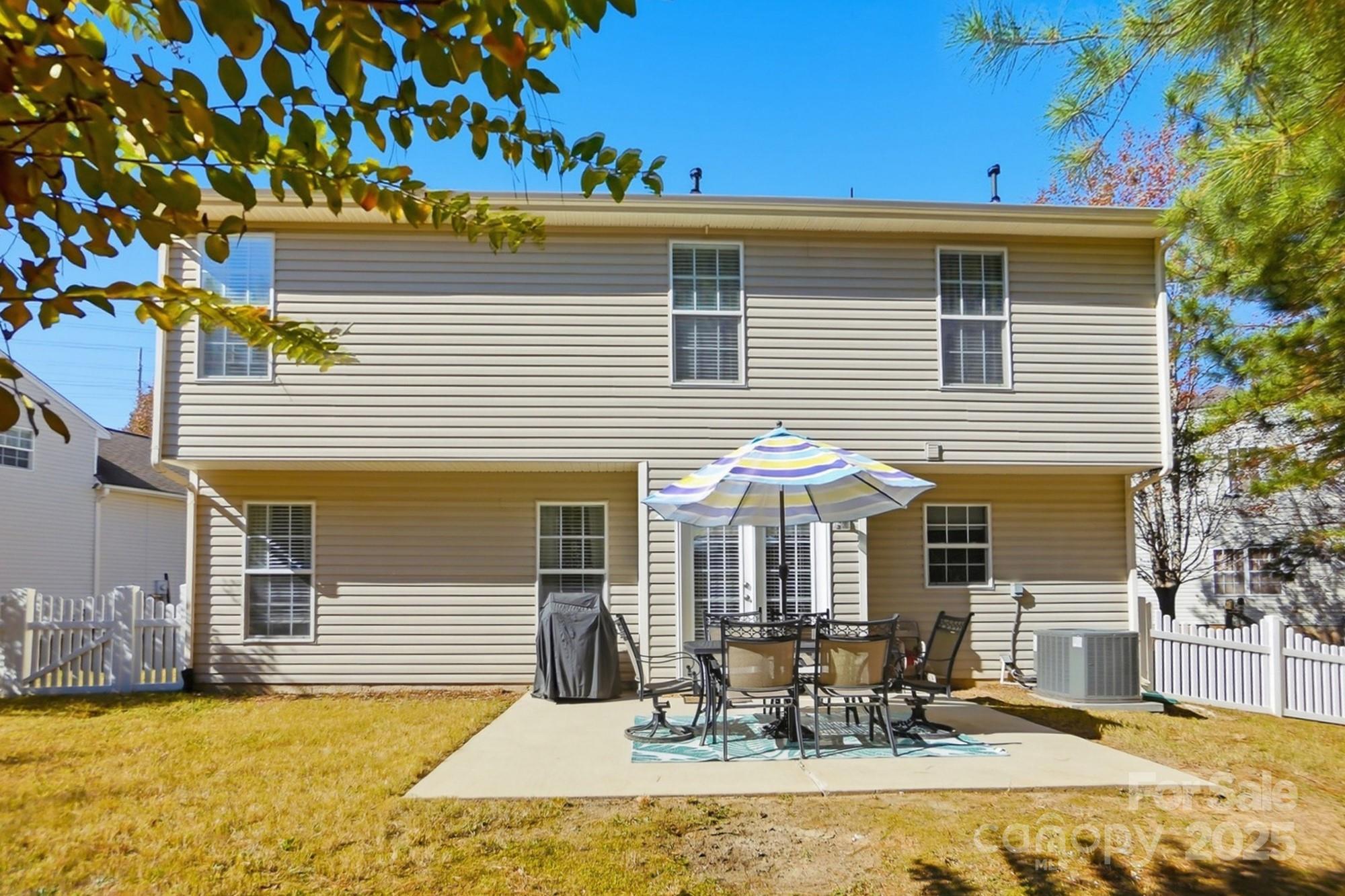 7200 Cascading Pines Drive Tega Cay, SC 29708 - Photo 34 of 39 a view of a house with a patio