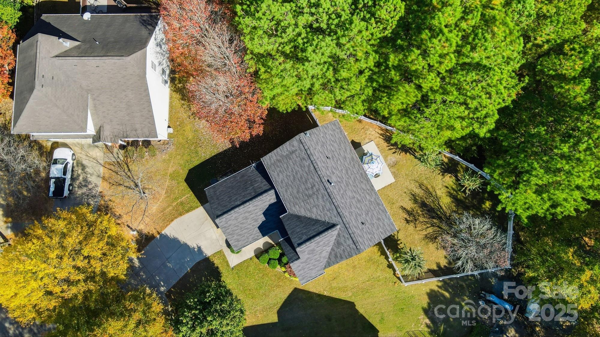 7200 Cascading Pines Drive Tega Cay, SC 29708 - Photo 4 of 39 an aerial view of a house with a yard and trees