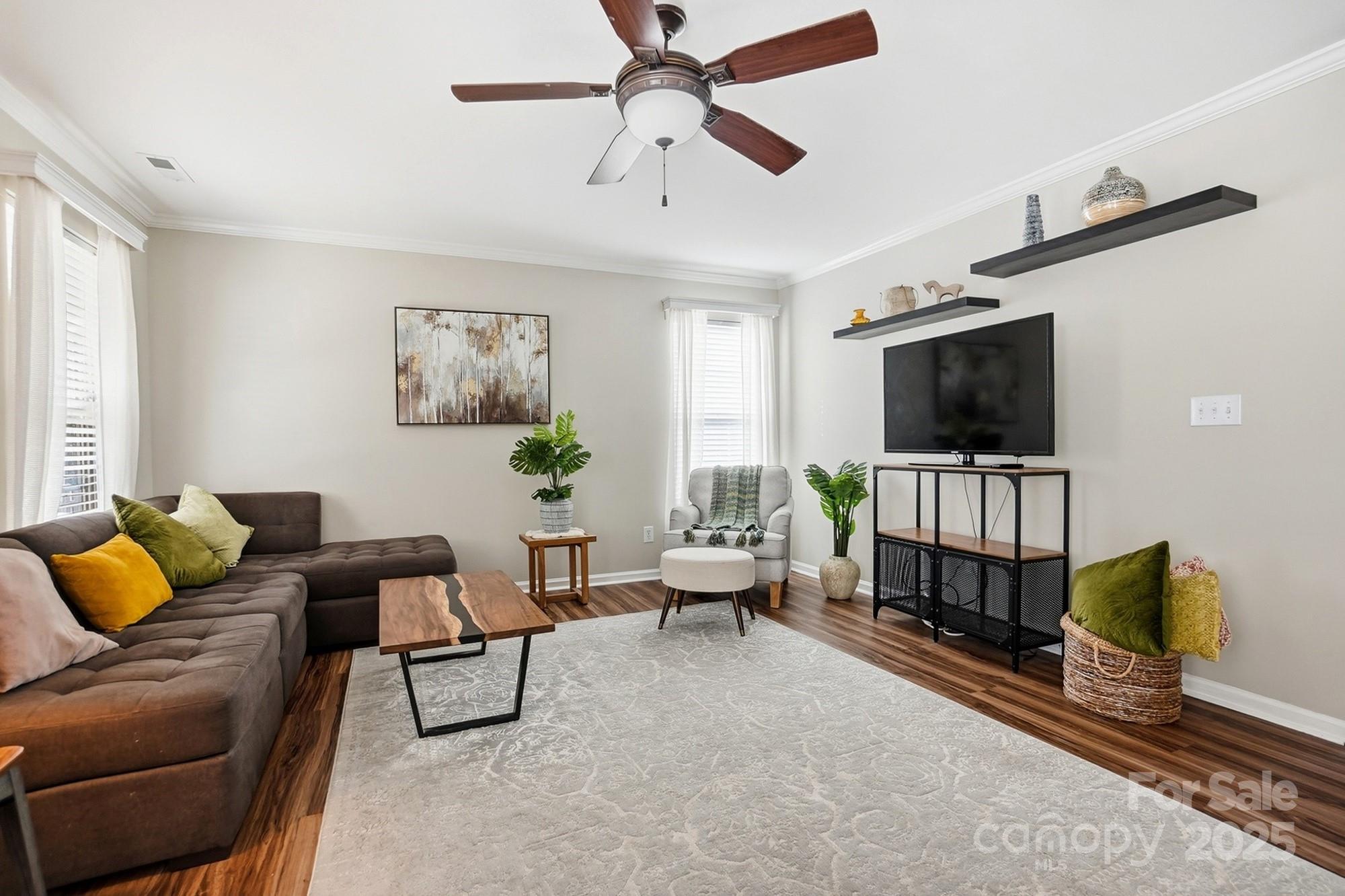 7200 Cascading Pines Drive Tega Cay, SC 29708 - Photo 9 of 39 a living room with furniture and a flat screen tv