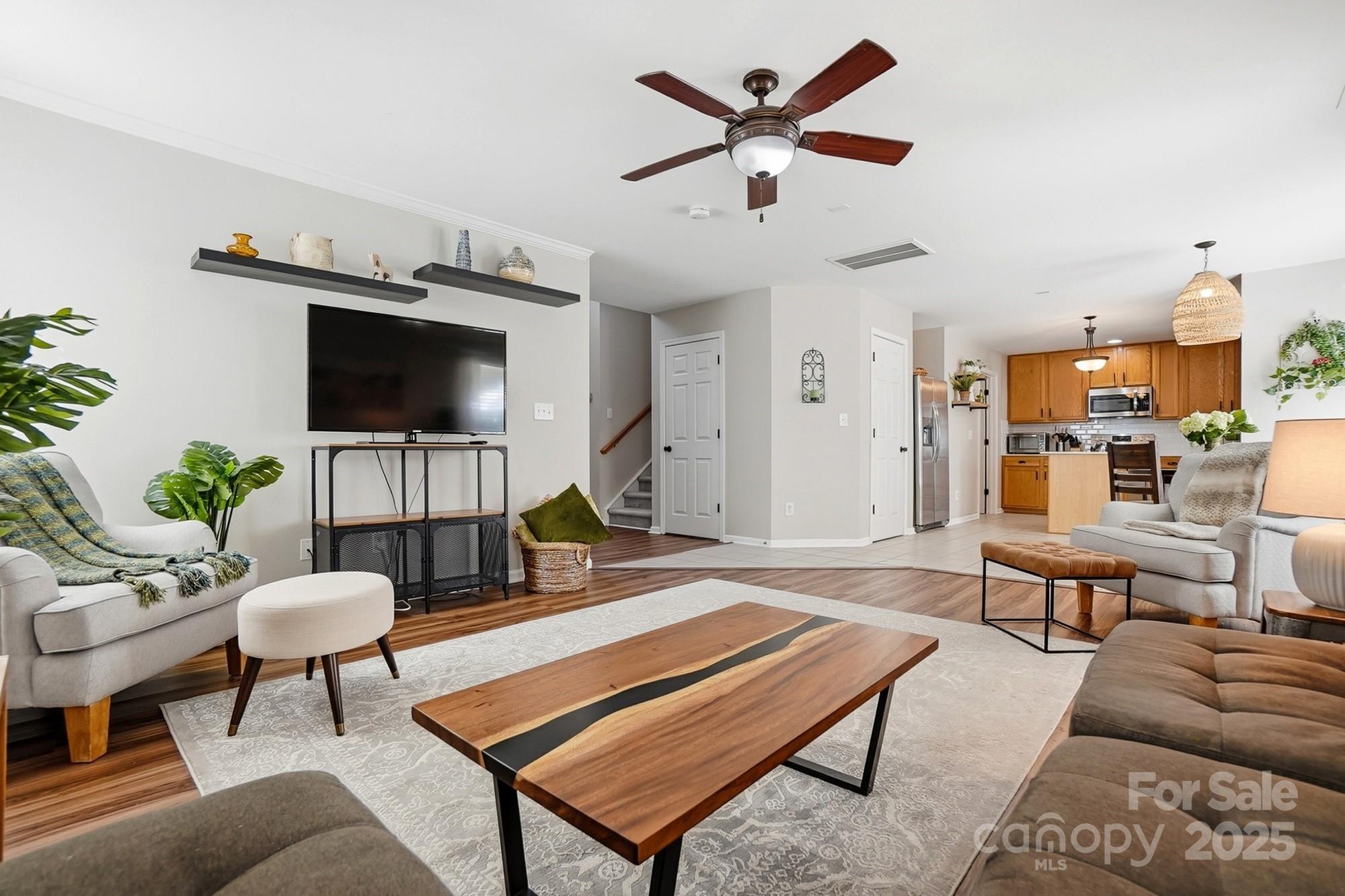 7200 Cascading Pines Drive Tega Cay, SC 29708 - Photo 10 of 39 a living room with furniture and a flat screen tv