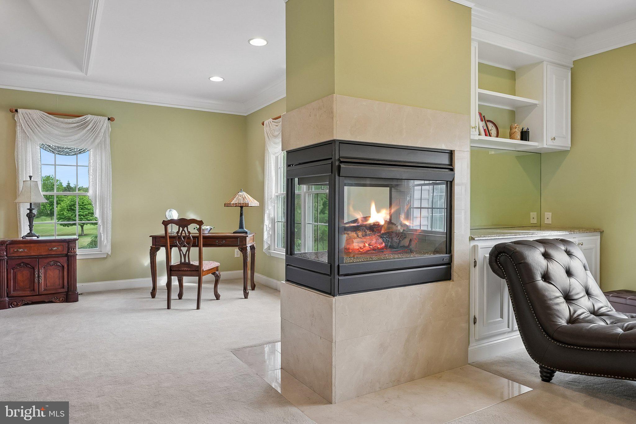 1 Baker Way Pennington, NJ 08534 - Photo 39 of 77 a living room with furniture and a fireplace