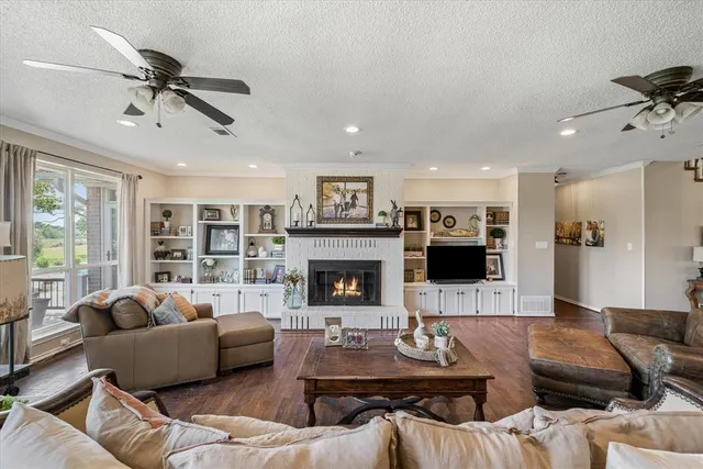 a living room with furniture and a fireplace