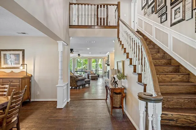 a view of entryway and hall with wooden floor