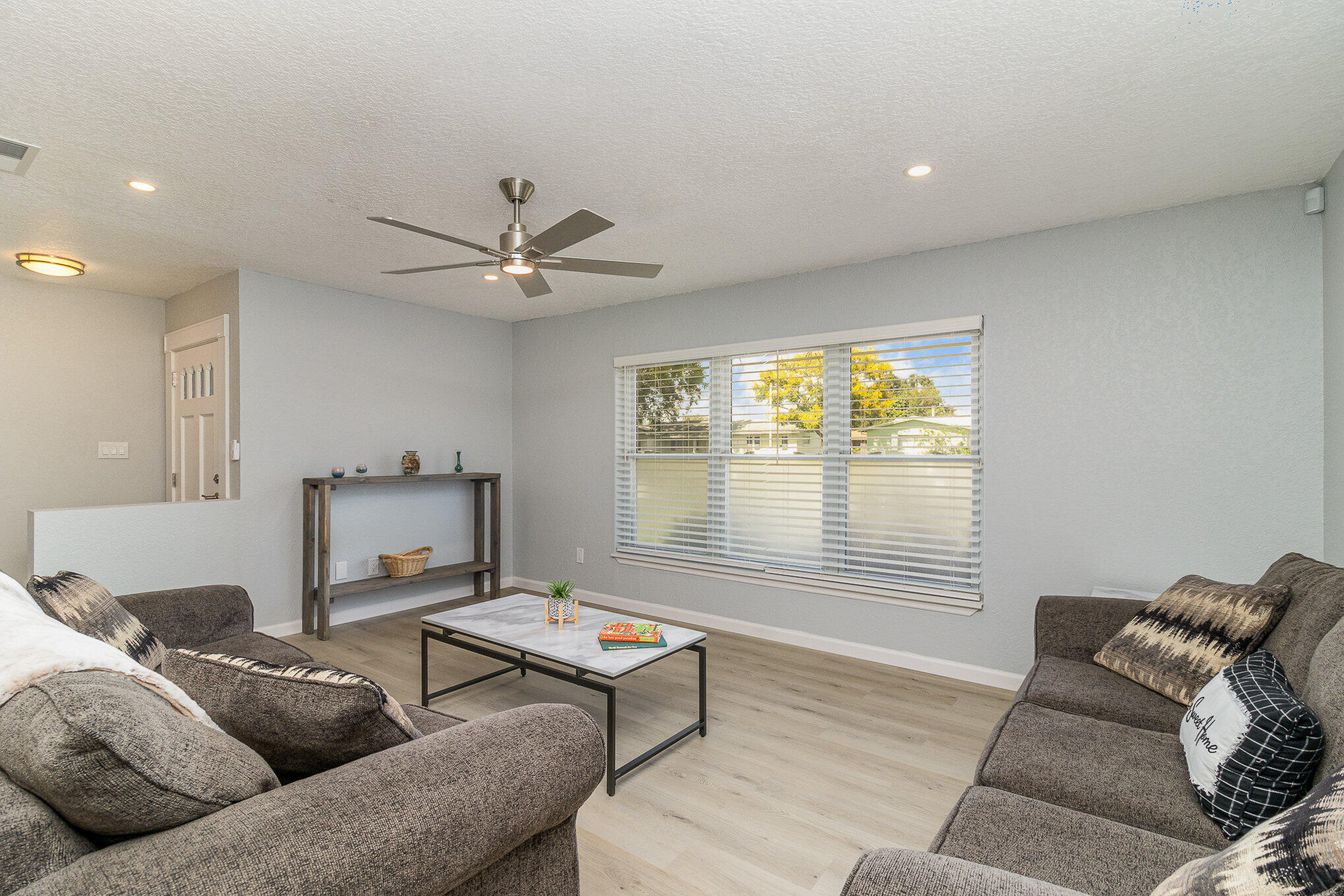 937 Kings Post Road Rockledge, FL 32955 - Photo 11 of 24 a living room with furniture and a large window