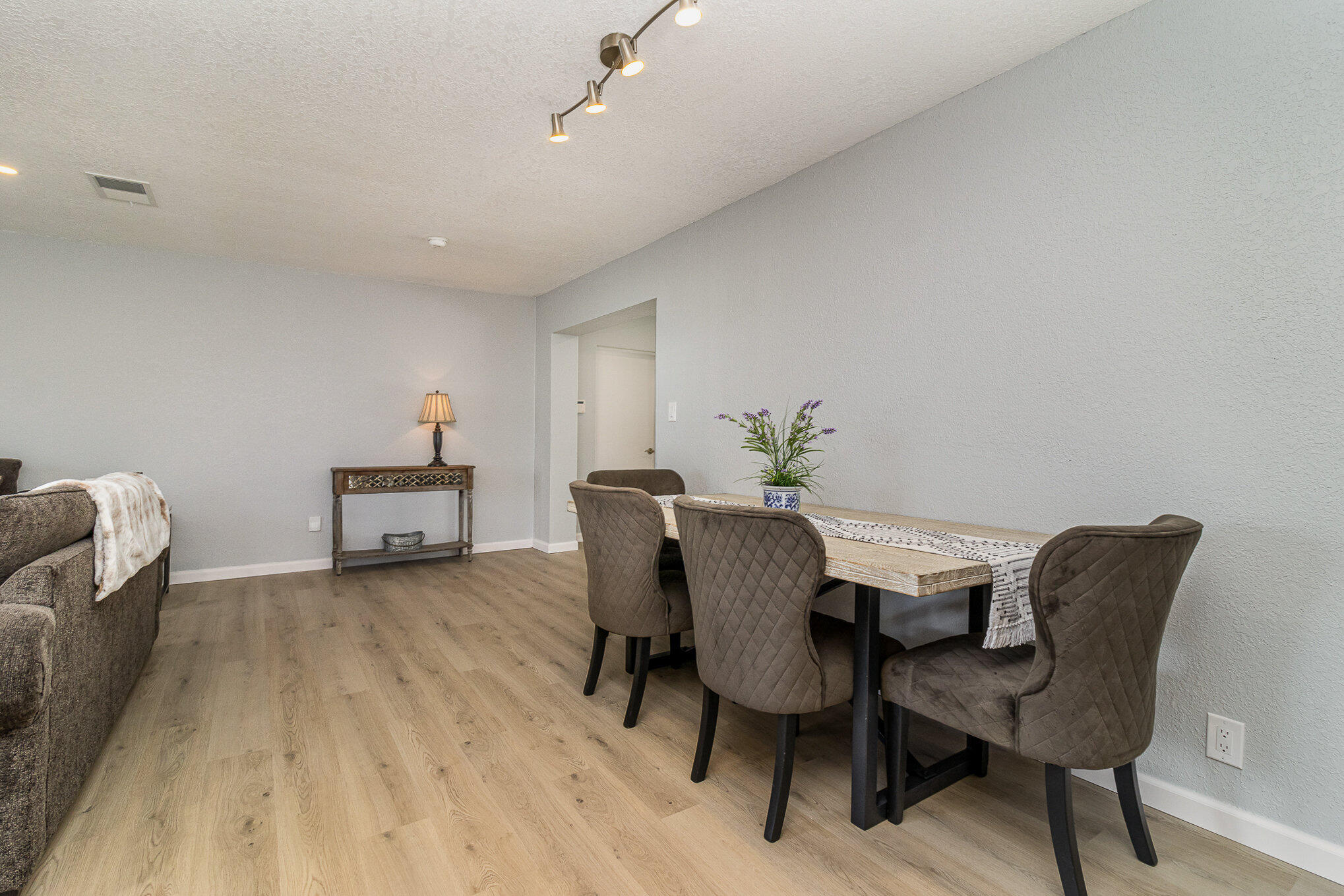 937 Kings Post Road Rockledge, FL 32955 - Photo 12 of 24 a view of a dining room with furniture and wooden floor